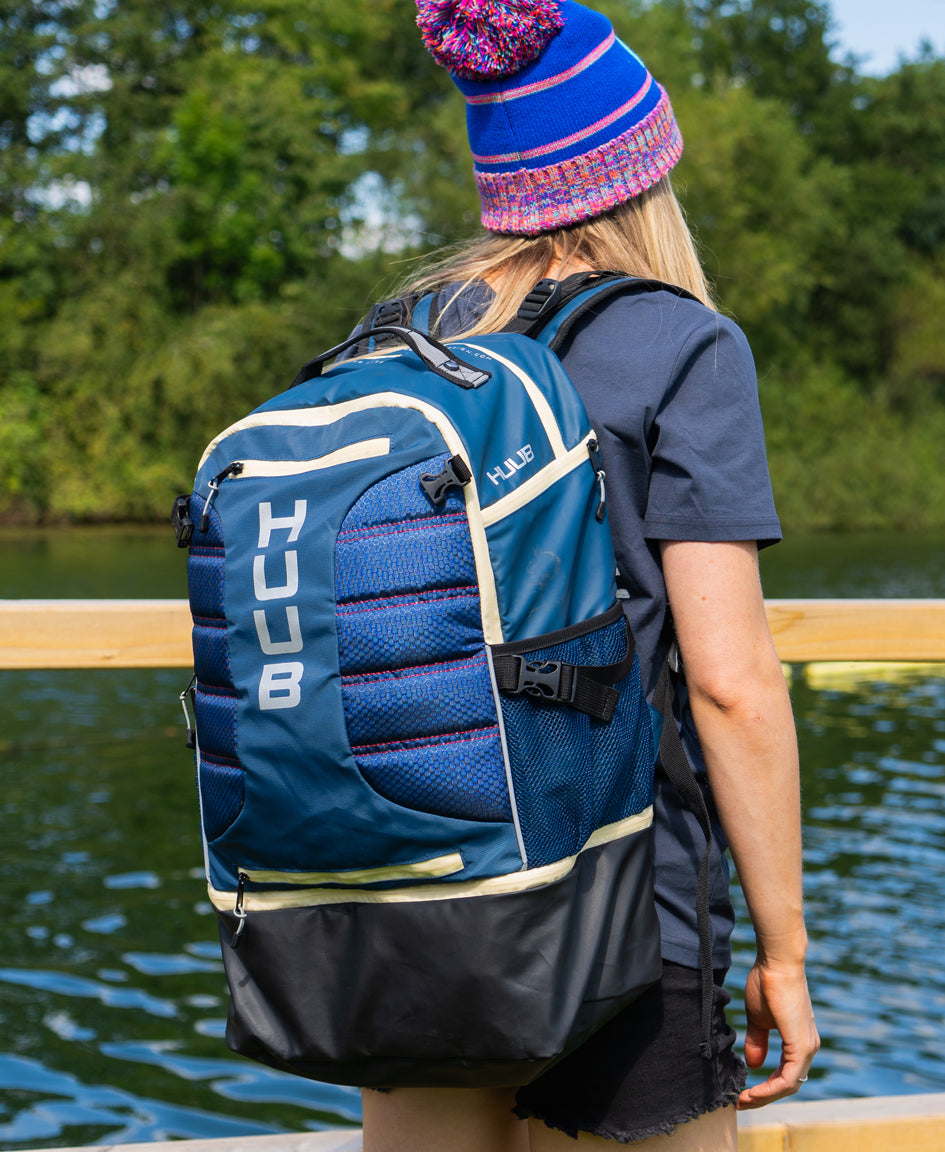 HUUB TT Bag – Transition Three, 40L rucksack, wet/dry, hidden helmet cradle, navy and olive/orange.