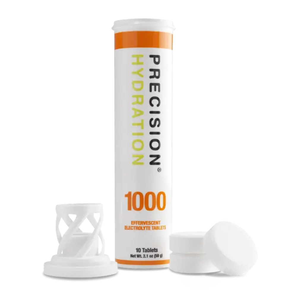 Precision Fuel & Hydration electrolyte drink tablets shown in a clear container with colorful tablets ready to dissolve in water.